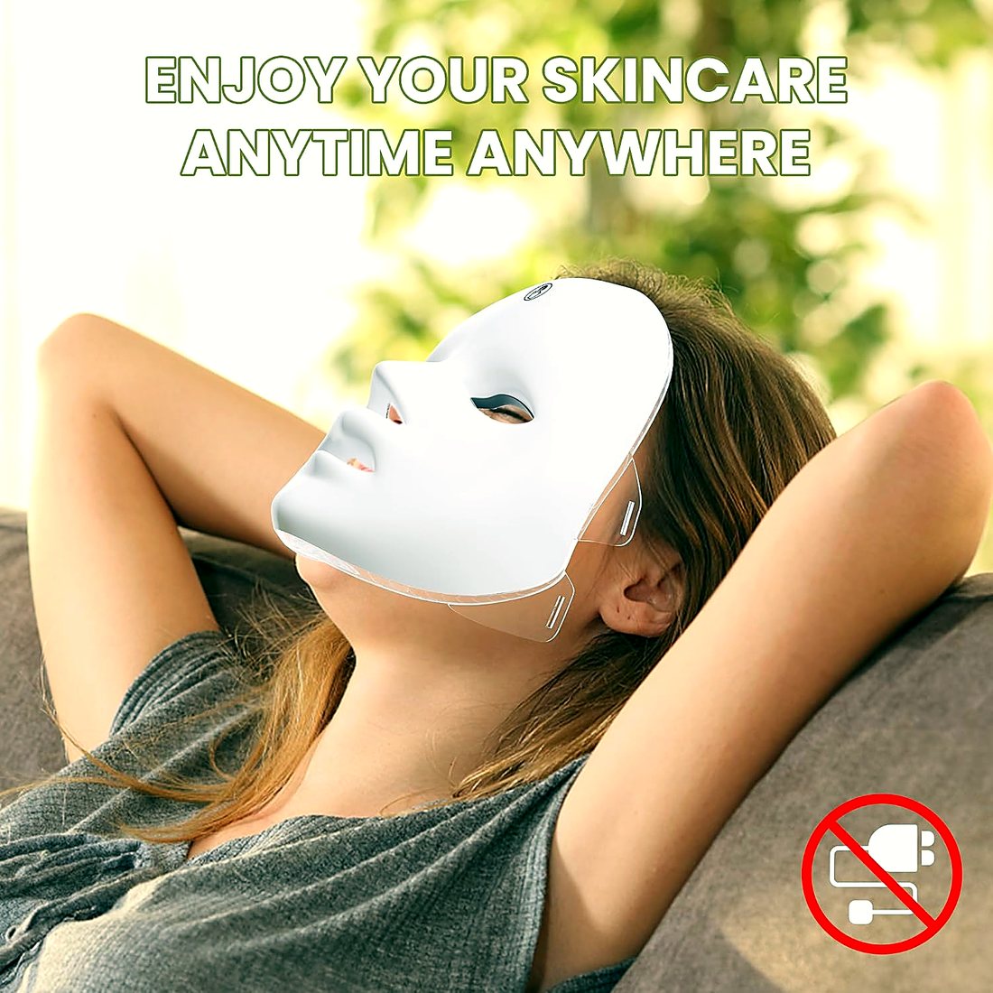 Woman relaxing on a sofa wearing the cordless mask